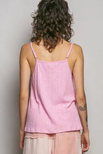 A soft pink textured knit cami with lace detail and thin straps made of ribbed cotton fabric