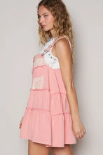 Pink denim overall dress with lace patchwork detail and adjustable straps in tiered design