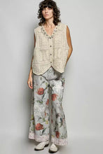 Beige pol lace trim sleeveless vest with floral embroidery and button closure in crochet fabric