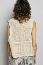 Cream-colored sleeveless pol lace trim vest with intricate floral and geometric embroidery in lightweight lace trim material