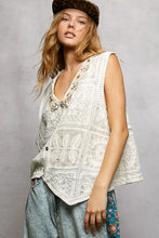 White lace patchwork vest with pol lace trim beaded embellishments and v-neckline in embroidered floral crochet design