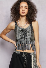 Black and gray patterned crop top with lace-up front fringe hem tank features fringe detailing and a decorative tassel