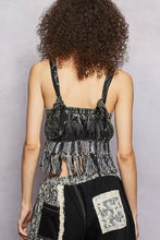 Black and white patterned lace-up fringe hem tank with ruffled straps and elasticized waistband featuring fringe hem detail