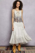 Off-white pol lace flowing maxi dress with corset bodice, layered ruffles, and fringe hem tank detail at waist