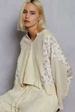Cream-colored bomber jacket with quilted knit floral-patterned sleeves offering the best fit and textured body