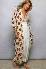 Pol Open floral crochet longline cardigan with rust-orange flowers over white dress