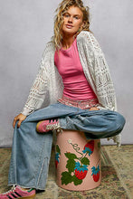 Pink cylindrical stool with strawberry floral designs on POL openwork lightweight cardigan