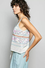 A light blue and white knitted tank top with pol printed contrast and blanket stitch floral embroidery across stripes