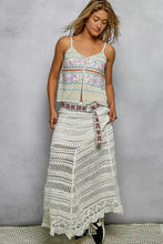 White crochet maxi skirt with intricate lace detailing and patterned belt paired with pol printed contrast button down cami with blanket stitch trim detail