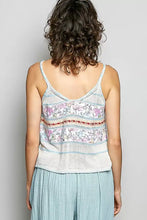 A light blue and white striped knit tank top with a floral pattern featuring pol printed contrast and blanket stitch detail