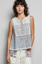 Pol printed woven sleeveless top in blue and white floral with lace trim on neckline and hem for elegant wear