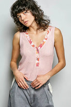 Pink knitted sleeveless ribbed tank with contrast floral neckband along v-neckline and front placket
