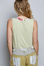 Light green ribbed knit sleeveless top with contrast floral neckband and striped belt for casual wear