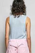 Light blue ribbed knit sleeveless top featuring a contrast floral neckband for a stylish casual look