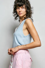 Light blue ribbed knit sleeveless tank top featuring a contrast floral neckband for stylish layering