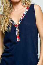 Navy blue ribbed knit sleeveless top with a contrast floral neckband v-neck trim in the POL ribbed v-neck tank