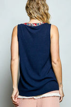 Navy blue ribbed knit sleeveless top with white lace trim and a contrast floral neckband for stylish layering