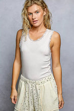 White pol round neck cami tank with lace trim made of soft stretchy fabric in sleeveless cropped style