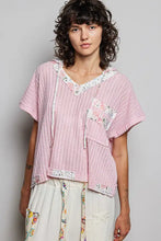 Pink ribbed cotton pol short sleeve hooded top with floral trim and patch pockets featuring back-open detail