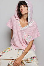 Pink ribbed pol short sleeve hooded top with floral trim patch pockets and back-open detail