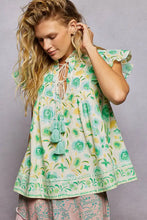 Pol tassel tied floral flutter sleeve blouse with ruffled sleeves green and yellow floral pattern on off-white fabric