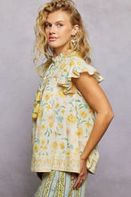 A light yellow and green pol tassel tied floral flutter sleeve blouse with ruffled sleeves and a tie-front neckline