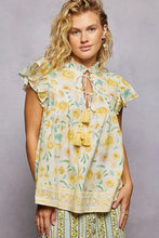 Soft off-white pol tassel tied floral blouse with ruffled sleeves and tie-front neckline with tassels