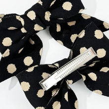 Black polka dot bow hair clip from red and black set