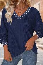 Navy blue ribbed knit long sleeve blouse with white polka dot trim and polka dot bowknot detail at neckline and cuffs