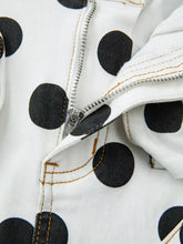 White denim high waisted jeans with black polka dots and silver zipper detailing for stylish casual wear