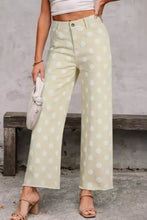 Cream-colored high-waisted wide leg jeans with a white polka dot pattern for stylish casual wear