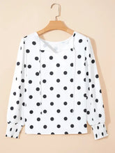 White blouse with black polka dots featuring sheer long dot long sleeve design for elegant wear