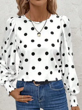 White long sleeve blouse with black polka dot long sleeve pattern and puffed sleeves in lightweight fabric