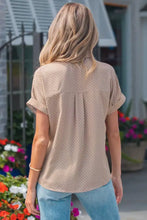 Beige polka dot print short sleeve shirt with subtle white dots and soft flowing fabric for comfortable wear
