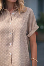 Beige short sleeve button-up shirt with white polka dots and collar in a lightweight fabric for casual wear
