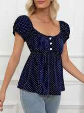 Navy blue polka dot short sleeve blouse with puff sleeves and white buttons for casual wear