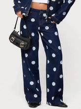 Dark blue denim polka dot wide leg jeans featuring bold white dots in a comfortable wide leg cut