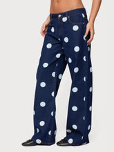 Dark blue denim polka dot wide leg jeans with bold large white dots pattern for stylish casual wear