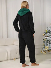 Black plush pom-pom trim zip front hooded lounge jumpsuit with green fleece-lined hood and full sleeve length