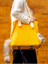 Borsa portatile traspirante per animali di colore giallo brillante con design valigia accogliente in peluche