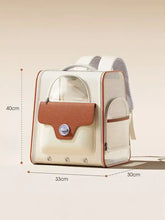 Portable breathable pet carrier backpack with cream body, brown flap, silver clasp