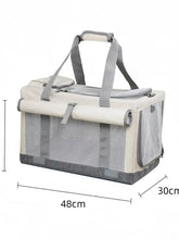 Portable breathable pet carrier bag in beige and gray mesh with handles and pockets