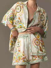 Printed button-up shirt and shorts set in vibrant paisley pattern