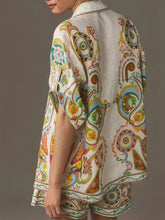 Vibrant off-white linen kimono jacket with colorful paisley print in Printed Button Up Shirt and Shorts Set