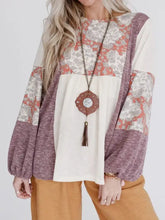 Printed color block balloon sleeve tunic with floral patterns and tassel necklace