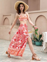 Woman in Printed Crop Top and Slit Skirt Set with coral pattern and straw hat
