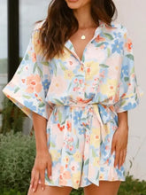 Light pink printed half sleeve tie waist romper with floral print