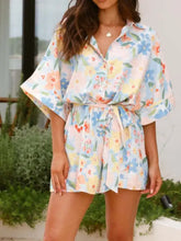 Printed half sleeve tie waist floral romper in light colors