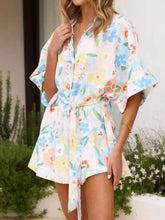 Printed half sleeve tie waist floral romper with bell sleeves
