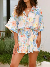 Printed half sleeve tie waist romper in light pink floral print